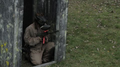 Girl Playing Paintball Firing Gun