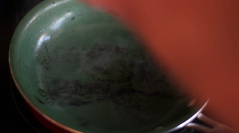 Cracking Egg In Frying Pan
