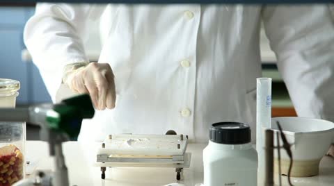 Shot Of The Young Pharmacists Making Pills