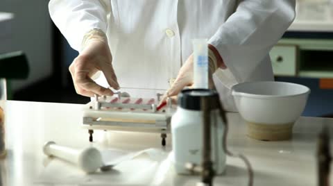 Shot Of The Young Pharmacists Making Pills