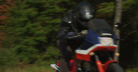 Motorcycle Doing Wheelie On Empty Highway In Autumn 4K