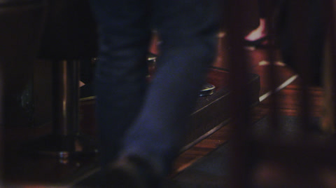 Vintage Diner - Close Up Of Man Walking Past Chairs
