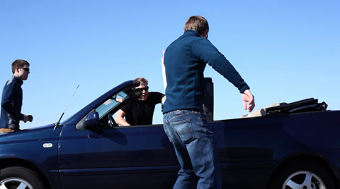 Group Of Young People Get Into Convertible