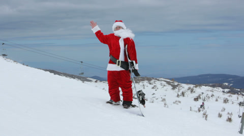 Santa Claus With Snowboard Waving To Camera