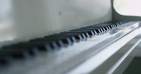 White Piano In Well Lit Room