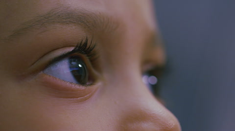 Eyes Of A Young Girl Focused On A Computer Screen In Slow Motion