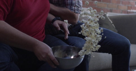 Sports Fans Celebrating A Win - Slow Motion Popcorn Spilling