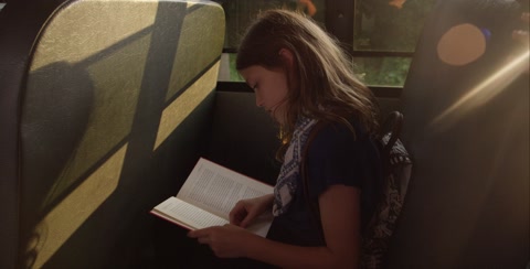 Girl Takes Book Away From Bookworm On School Bus
