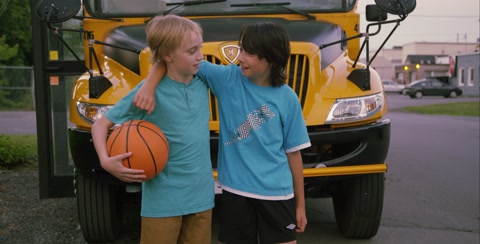 Friends Horsing Around With Basket Ball Before School