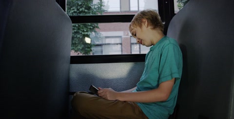 Boy On Ipad In Bus