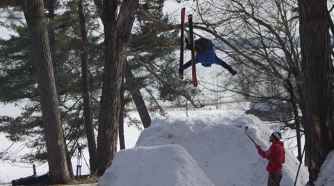 Extreme Sport Winter Tricks On Ski Hill Jumps - Back Flip From Behind