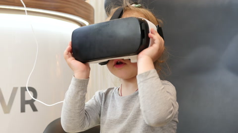 Little Child Kid Girl Watching Animation Film Through 3D Virtual Reality Glasses