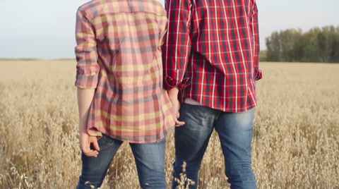 Father And Son Together In Field