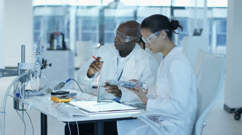 4K Electronics Engineers Working In Lab Building & Testing Electronic Devices