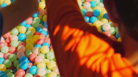 Kids Sliding Down To A Ball Pool