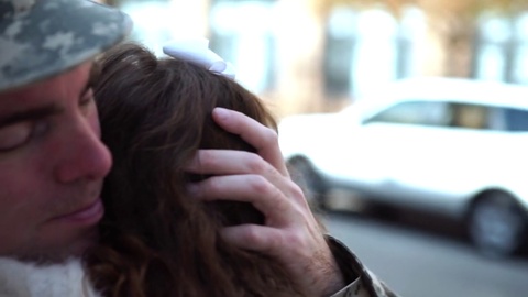 Slow Motion Close - Up Of Soldier Embracing A Child