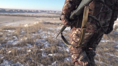 A Hunter Walking In A Field